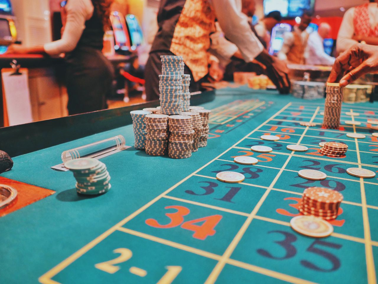 Salon staff at a green table during an evening roulette sitting